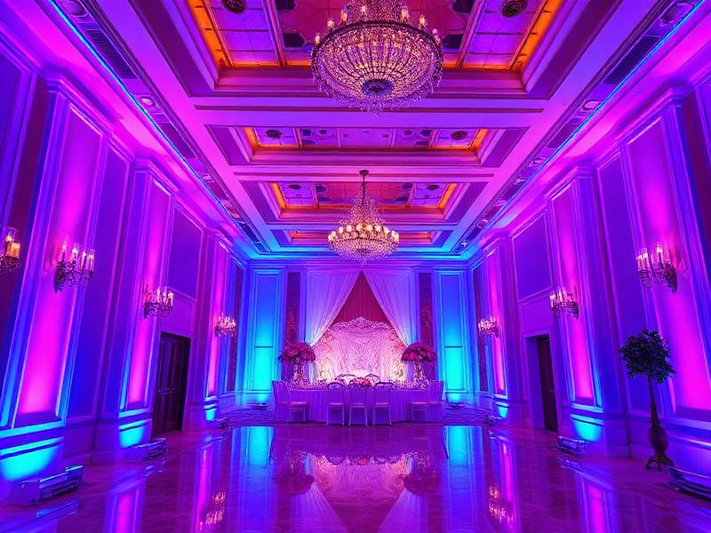 LED uplighting creating colorful ambiance at Dubai wedding reception venue